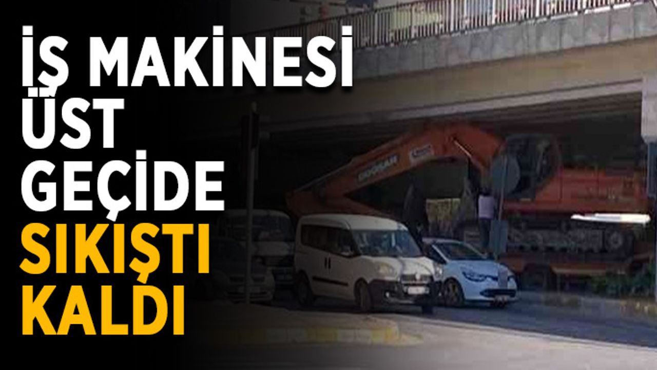 İş makinesi üst geçide sıkıştı kaldı