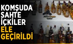 Komşuda sahte içkiler ele geçirildi