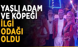 Yaşlı adam ve köpeği turistlerin ilgi odağı
