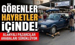 Görenler hayretler içinde! Alanyalı pazarcılar arabaları sürüklüyor