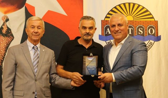 Başkan Erdem ve Kural’dan anlamlı plaket